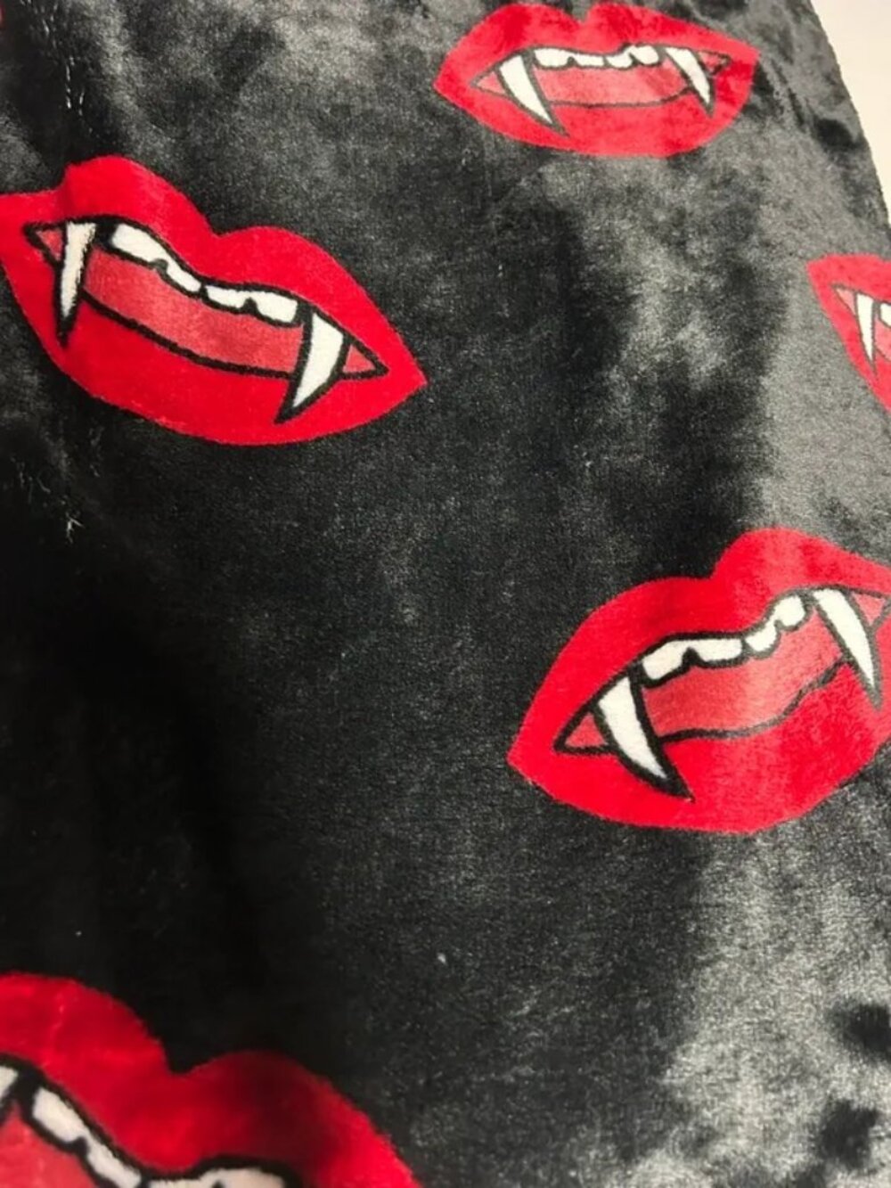 Madam troussou’s fangs Halloween throw blanket
